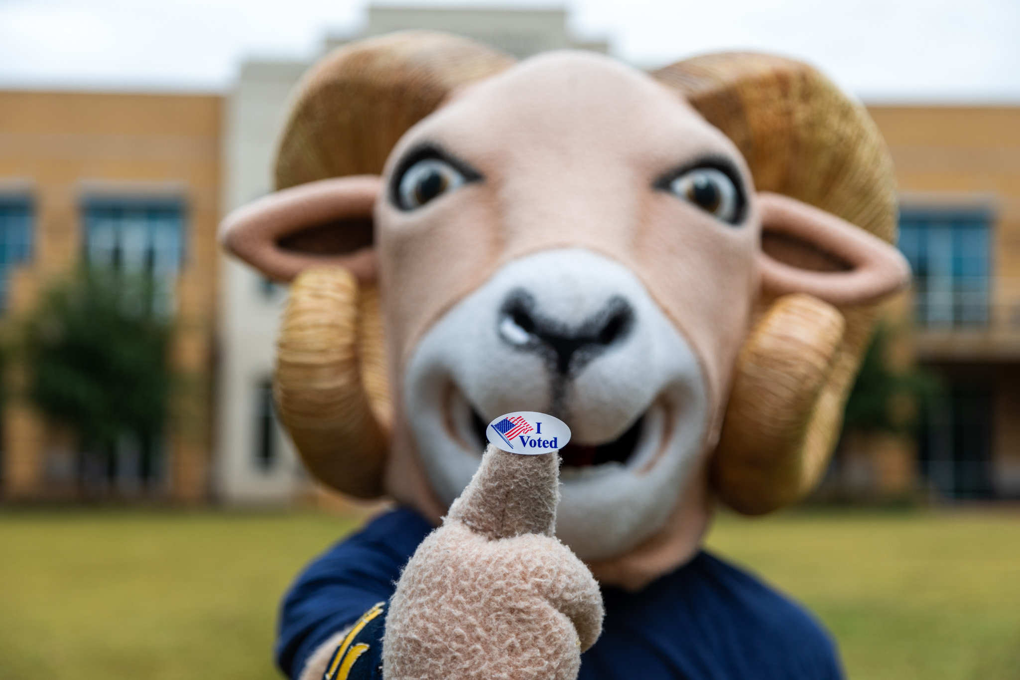 Willie the Ram holding an I voted sticker
